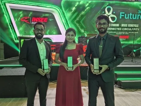 The EcoSync team holding their awards in front of the Circulatory Challenge backdrop